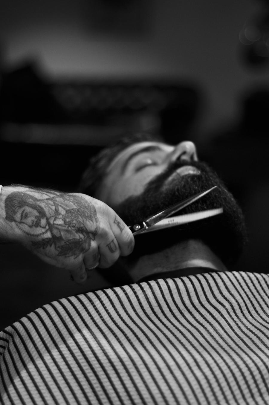 Barber giving a straight razor shave