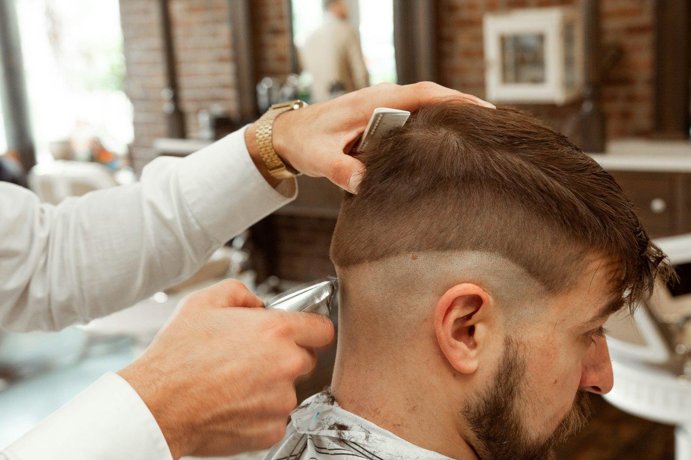 Barber finishing a skin fade